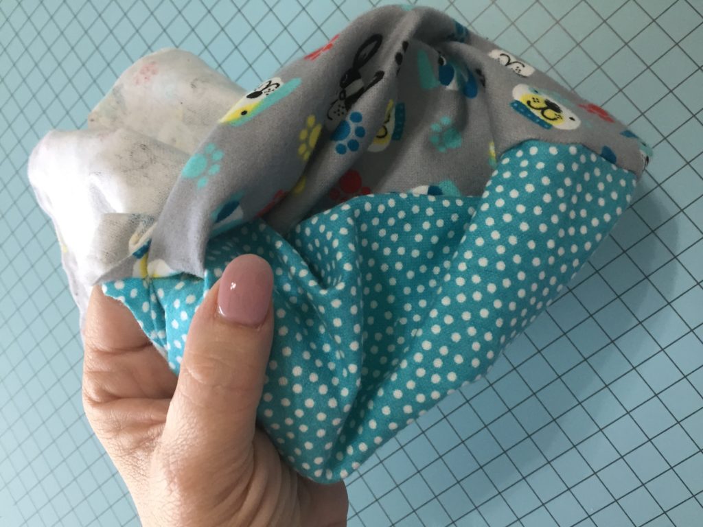 woman turning DIY burp cloth inside out