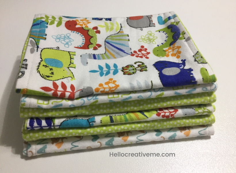 stack of green and white DIY burp cloths