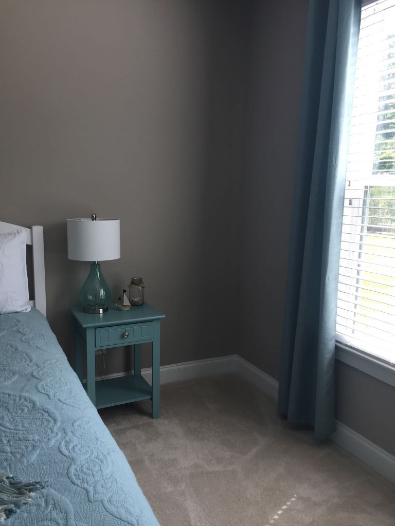 corner of guest room with nightstand