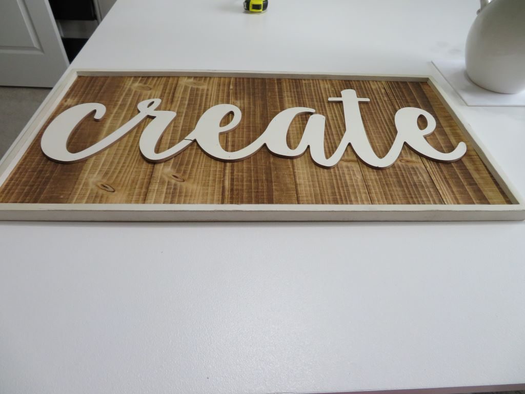 damaged wooden word create sign