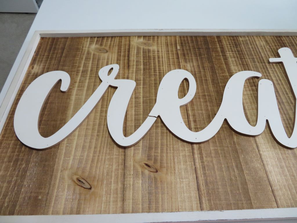 damaged wooden word sign 