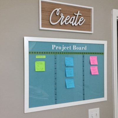 Blue DIY Project board and DIY farmhouse sign on wall