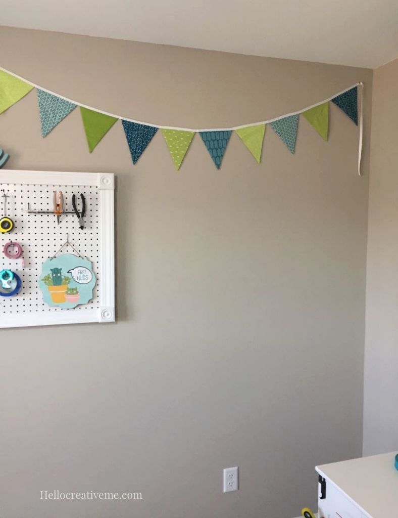 blank wall space to the right of a DIY framed pegboard.