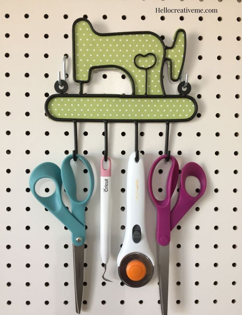sewing machine tool holder on pegboard