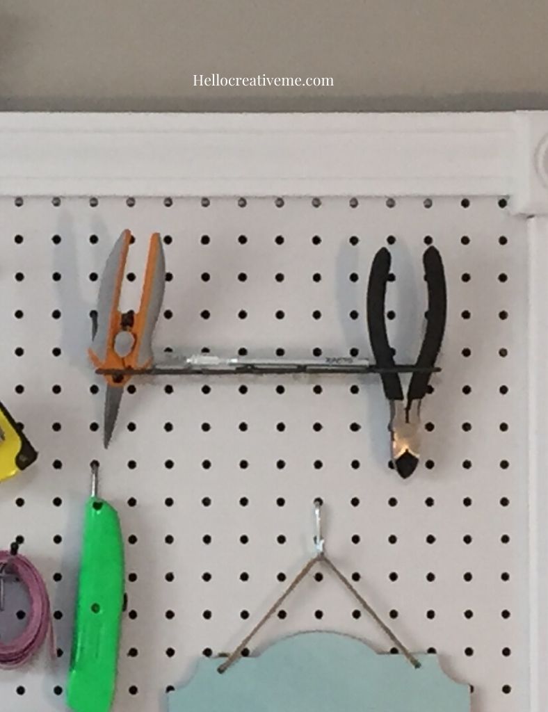 tool holder and tools on pegboard