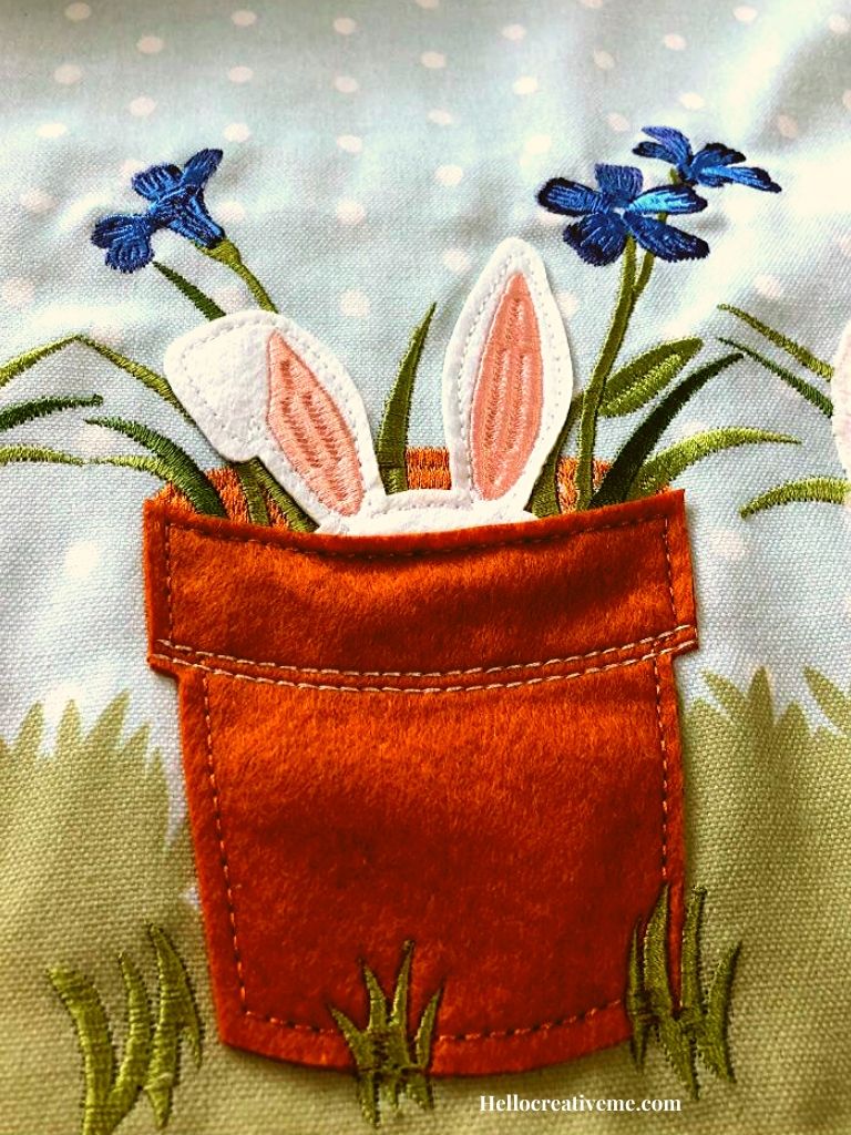 Bunny hiding in brown felt flowerpot