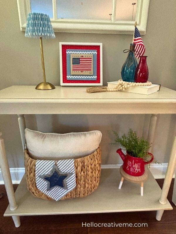 American flag DIY cross stitch finishing framed and styled as patriotic home decor.