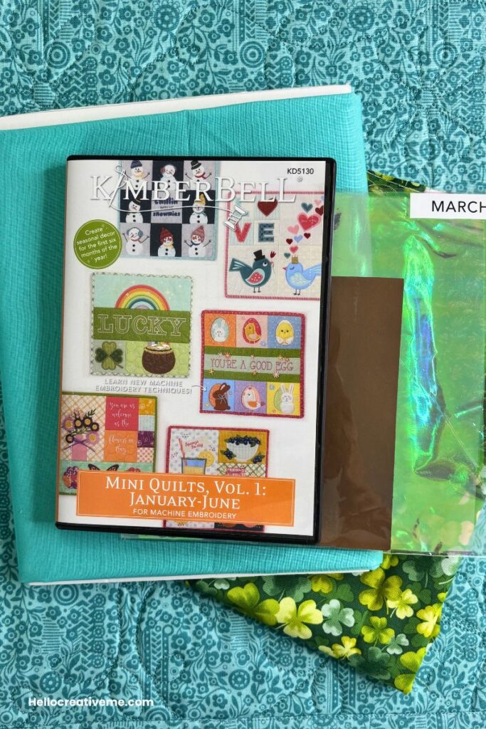 Mini quilt embroidery design CD along with fabric and embellishments to complete it.
