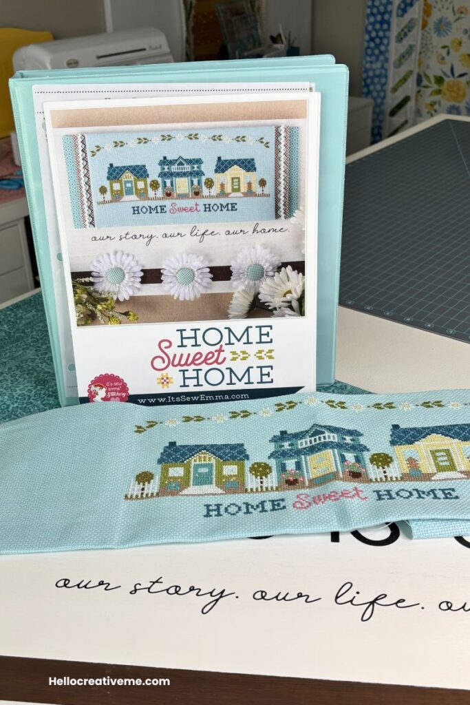 The Home Sweet Home completed cross stich piece along with the pattern showing it fully finished.